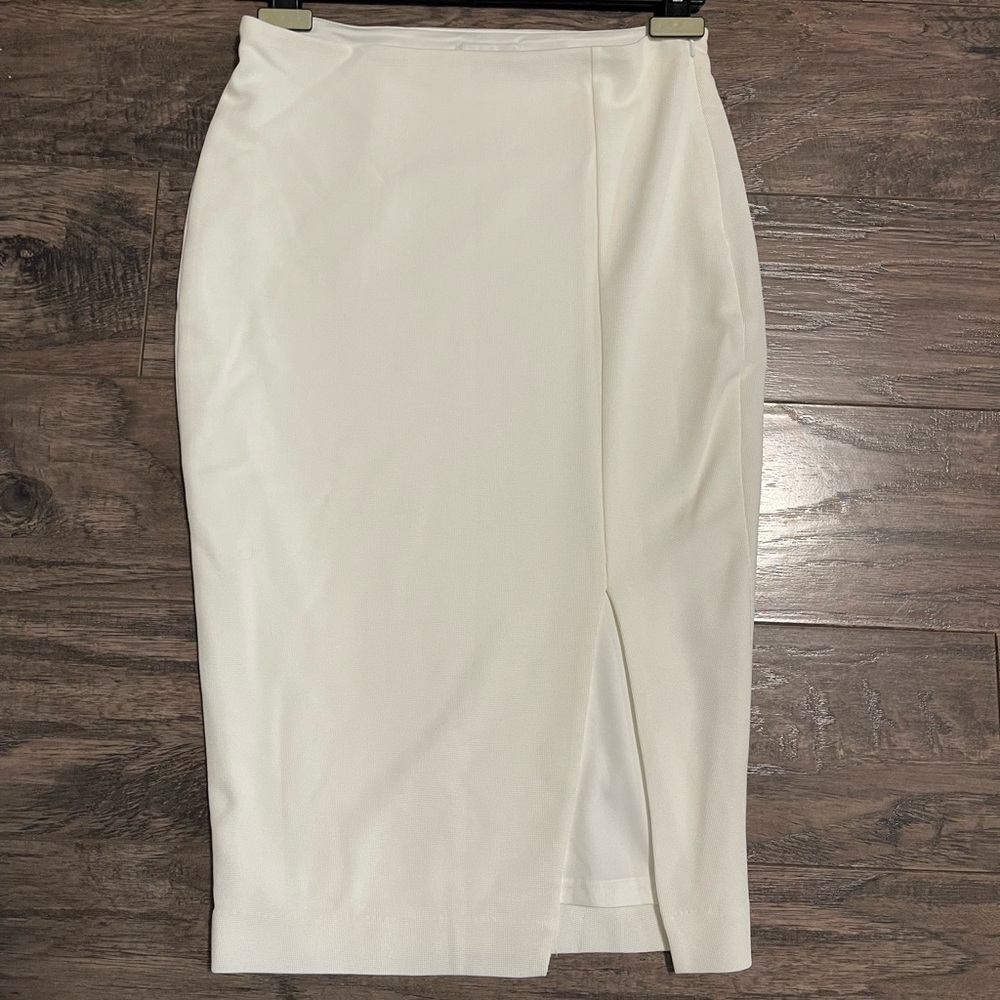 Pencil skirt with slit. About 3/4 length.